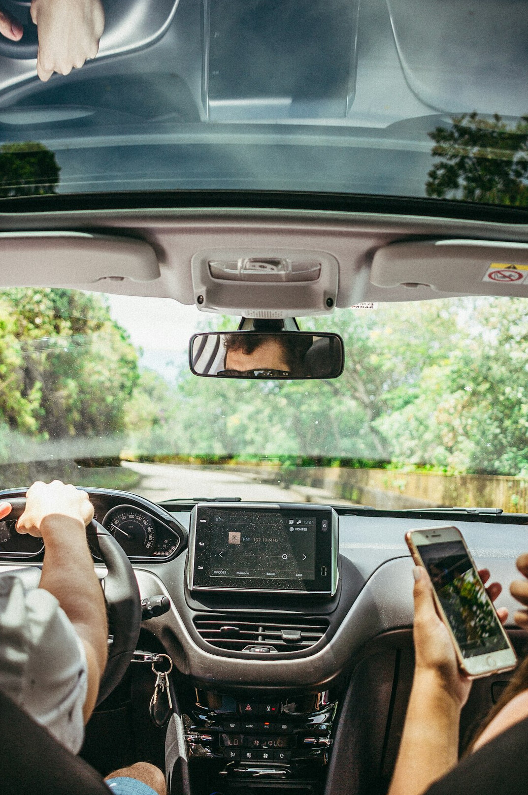 driver using car touchscreen