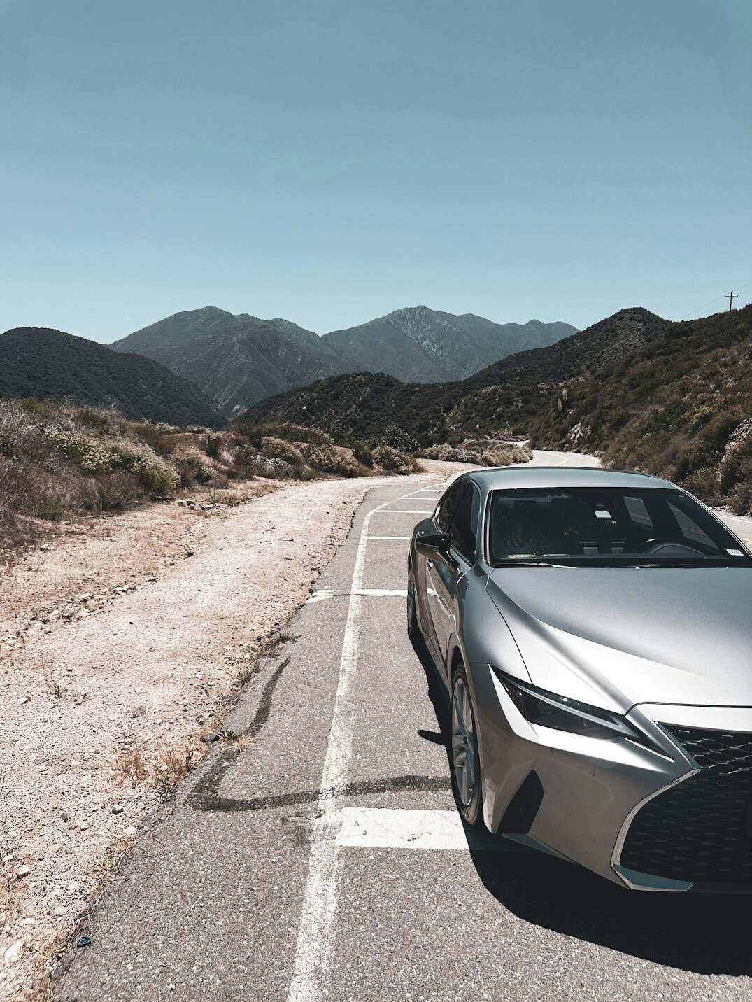 luxury car on mountain road